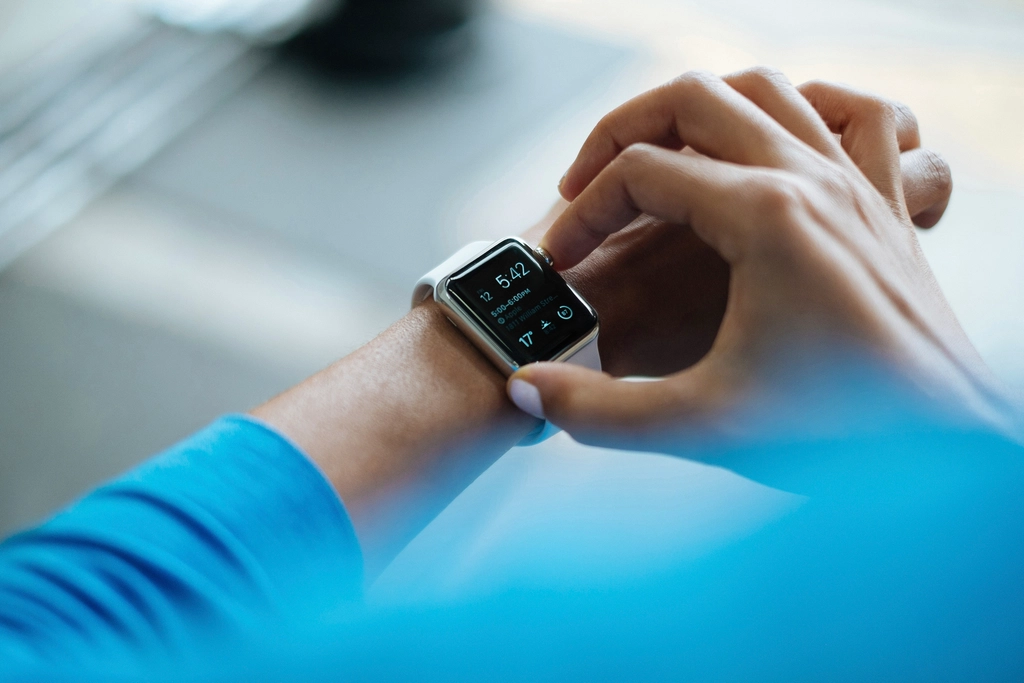 Person clicking Apple Watch